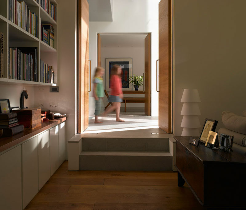 This living room has built-in shelving and white cabinetry.