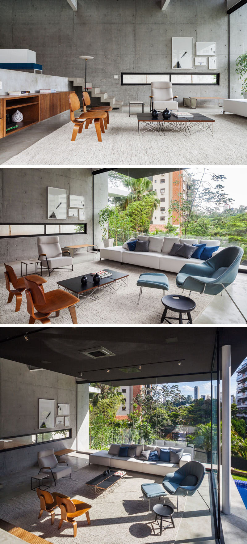 Stepping down to the living area of this modern house, you can see how the large windows flood the entire space with plenty of natural light, which helps to brighten the unfinished concrete walls, while a large rug makes the room feel warmer and assists in anchoring the furniture in the large room.