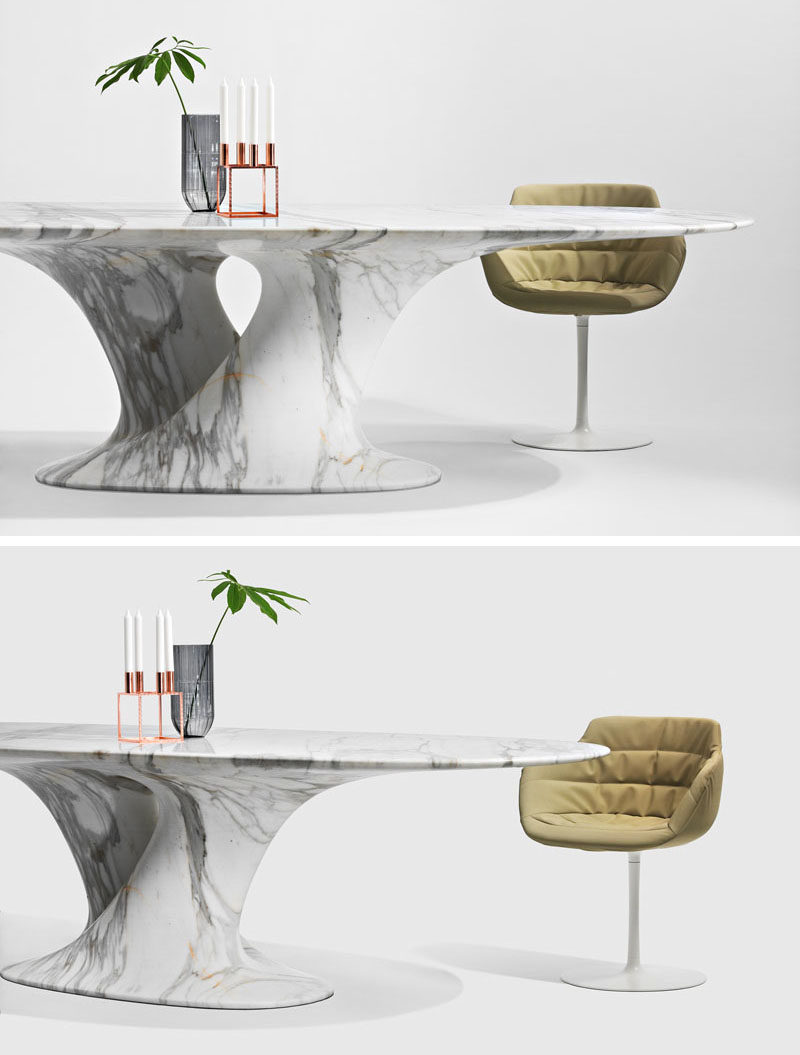 Austrian designer Rainer Mutsch has created a collection of contemporary furniture made entirely out of marble, that includes a sculptural dining table.