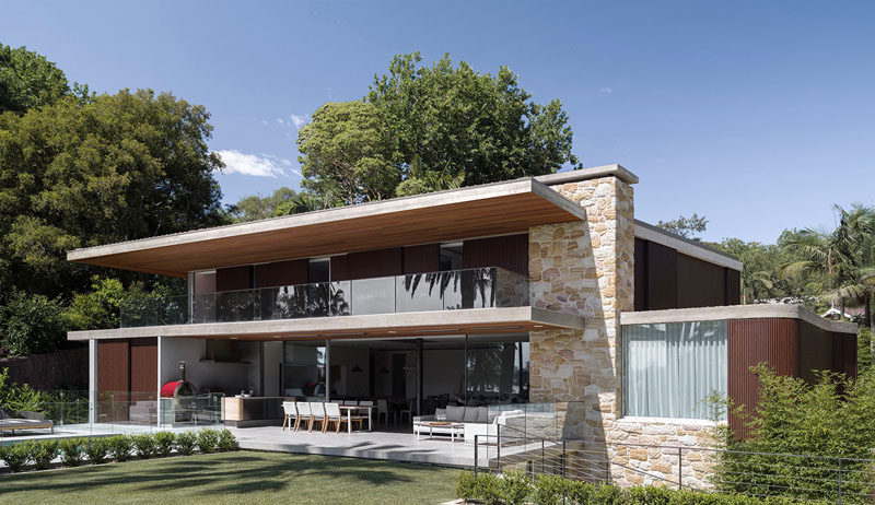 Luigi Rosselli Architects have designed a contemporary house in Sydney, Australia, that features a sandstone and wood exterior.