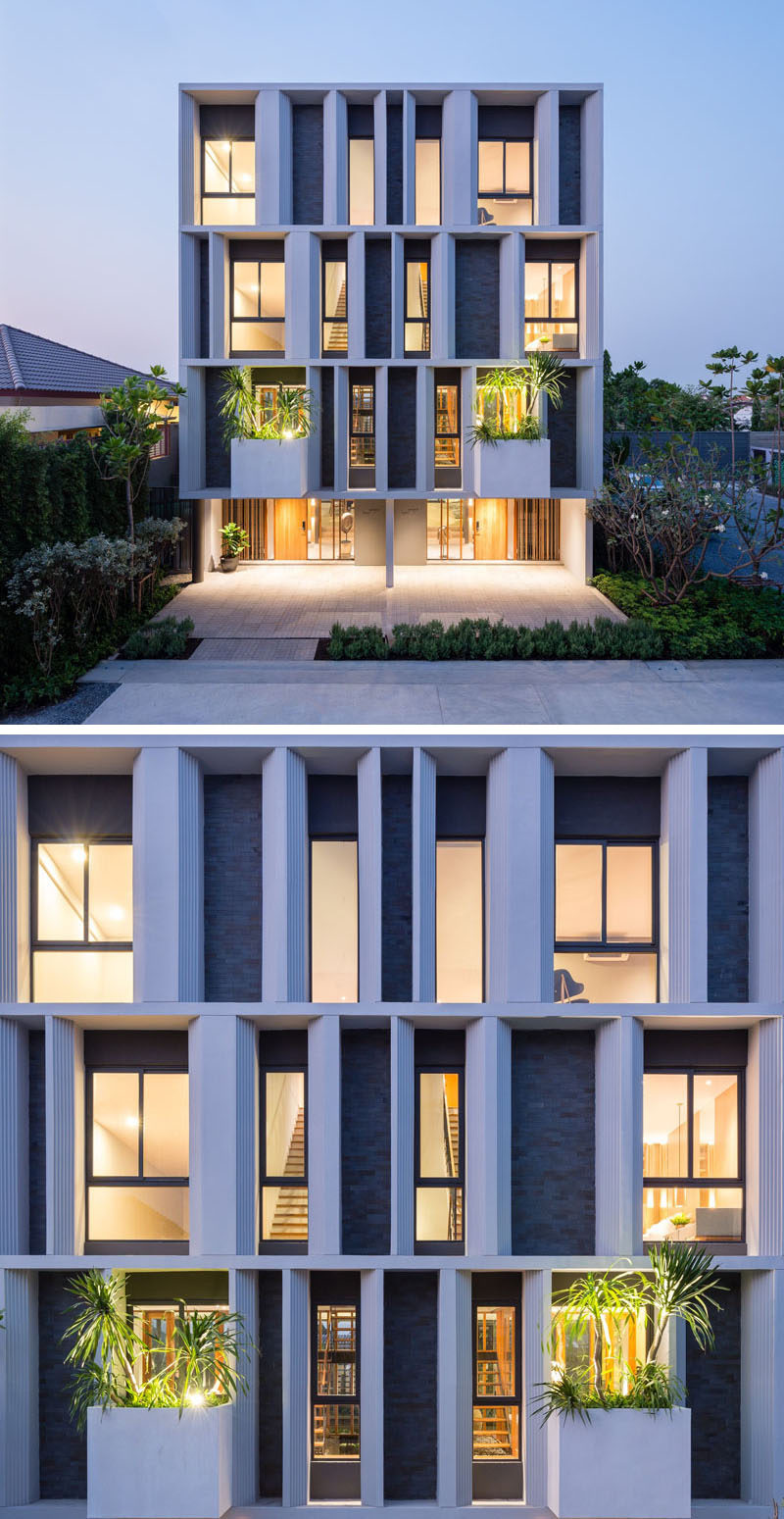 The facade of these townhouses have set back windows, so that the angled concrete sections provide shade for the interior, as well as visual interest from the street.