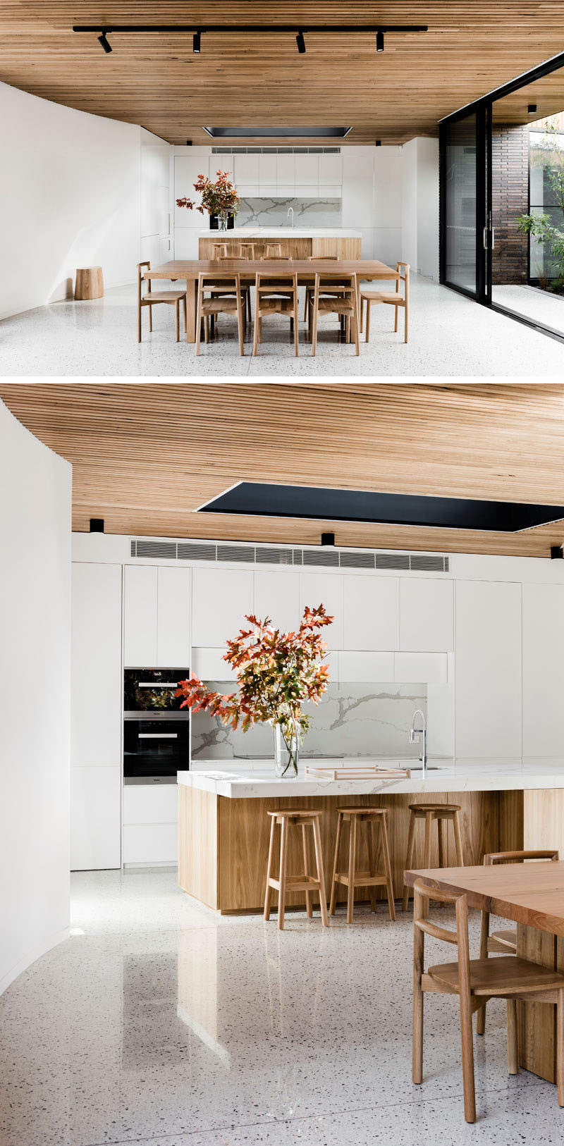 The light wood dining table and chairs compliment the ceiling and tie in with the modern and bright kitchen.