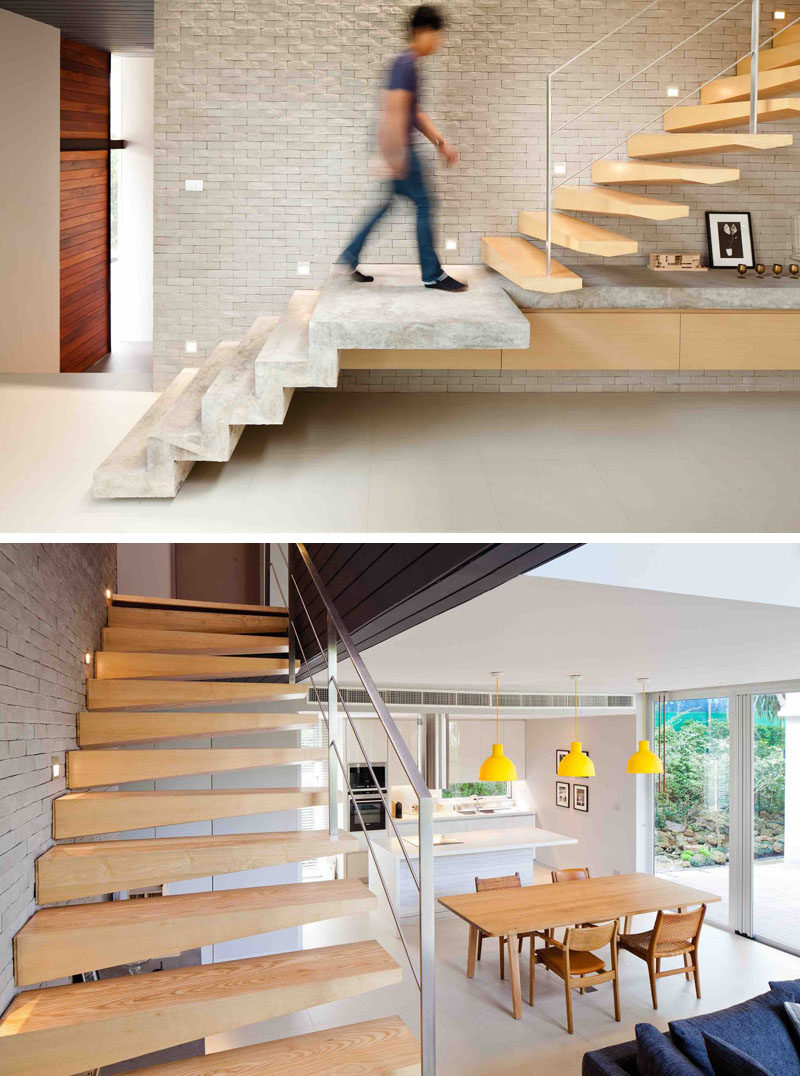 These modern concrete and wood stairs lead to the second floor of this modern house. The concrete steps continue on to create a display space for a floating cabinet, while the the wood stairs are slightly sculptural in their design. When heading upstairs, you are also able to look down on the dining area and kitchen.