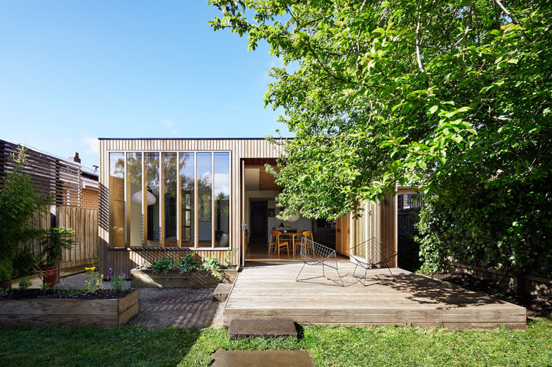 This contemporary wood extension with back deck was added to a turn-of-the-century house in Australia.