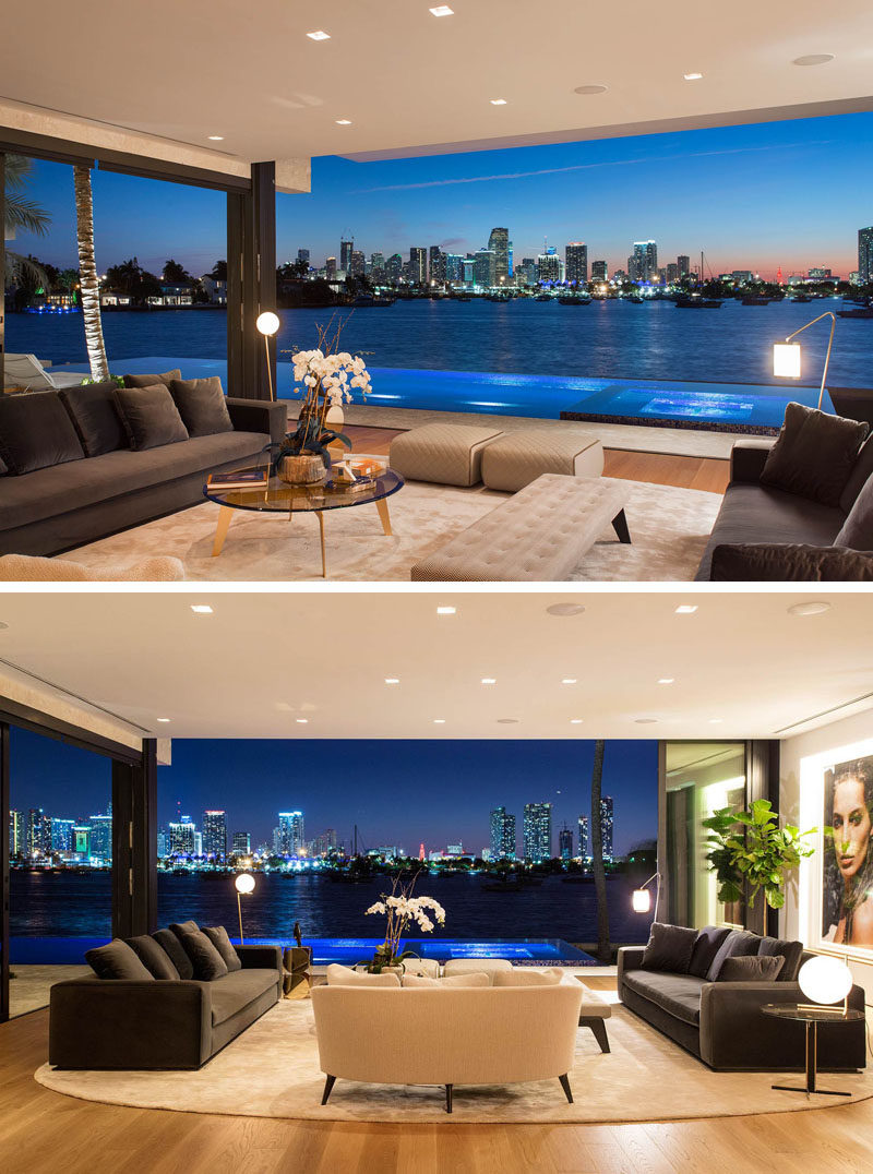 In this modern living room, the sliding glass doors can be opened completely, so that the living room has an uninterrupted view of downtown Miami.