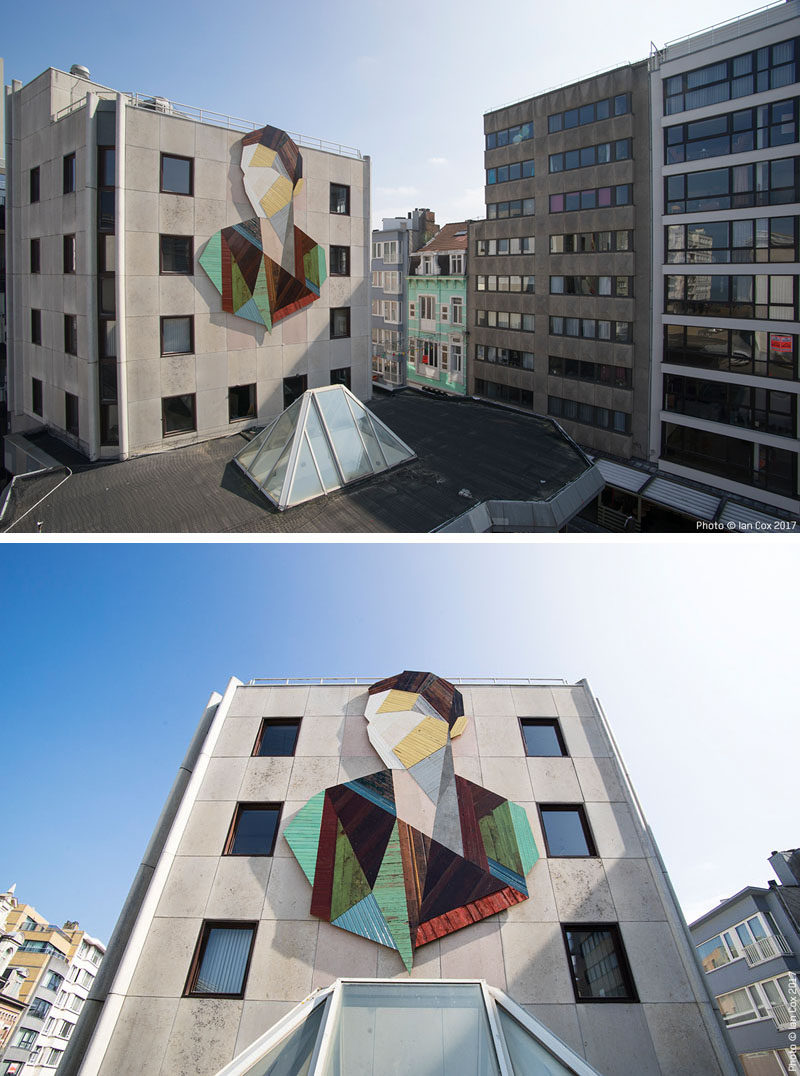 Artist Stefaan De Crook (also known as Strook), has created a large recycled wood mural on the side of a building in Ostend, a coastal city in Belgium.