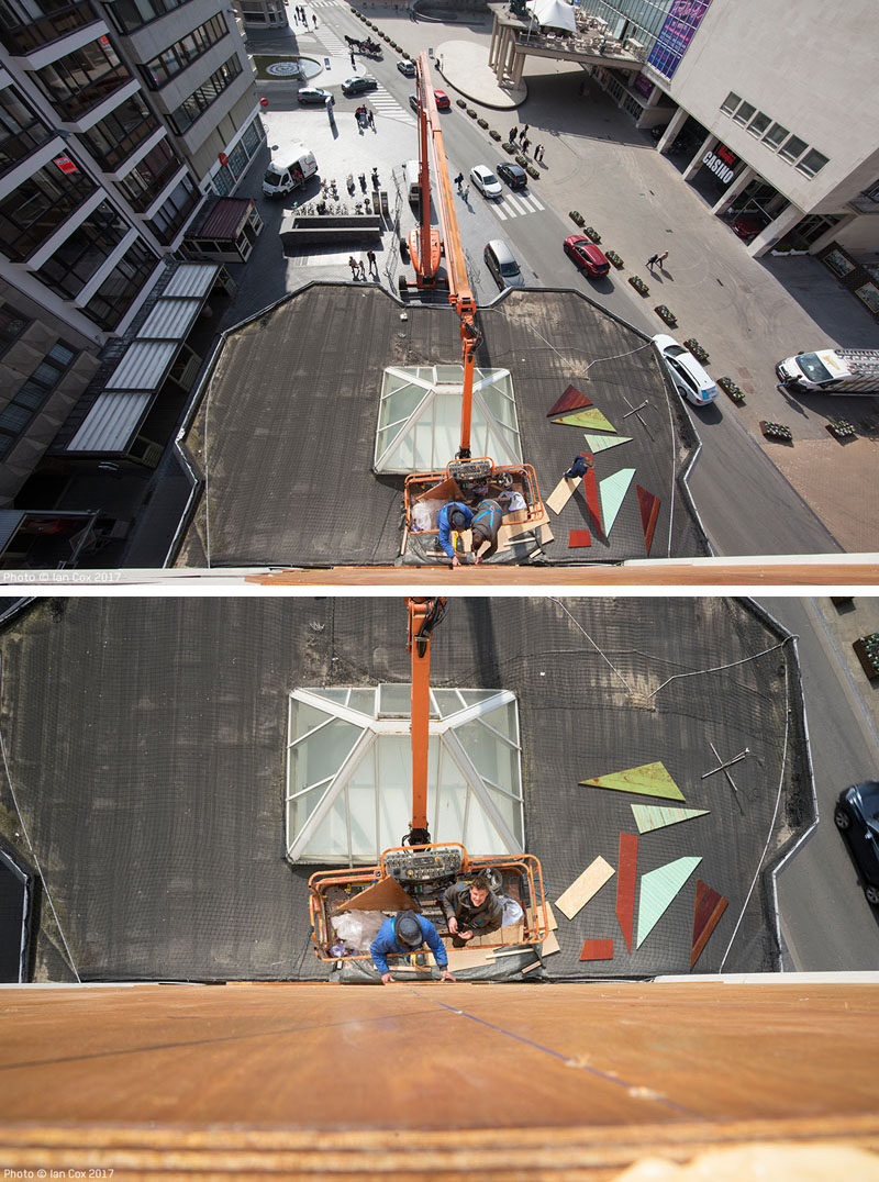 Artist Stefaan De Crook (also known as Strook), has created a large recycled wood mural on the side of a building in Ostend, a coastal city in Belgium.