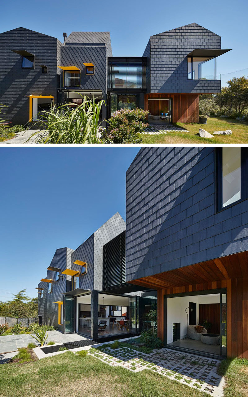 Dark grey slate tiles covers this modern home and from this angle, you can see how the patterns of the tile installation change depending on the section of the house.