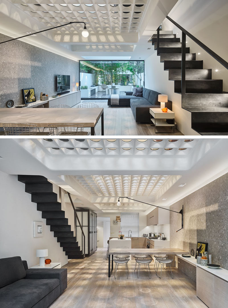 This modern house in London has a unique floor made from pavement lights that have been re-purposed to allow natural light to fill the two levels of the house.