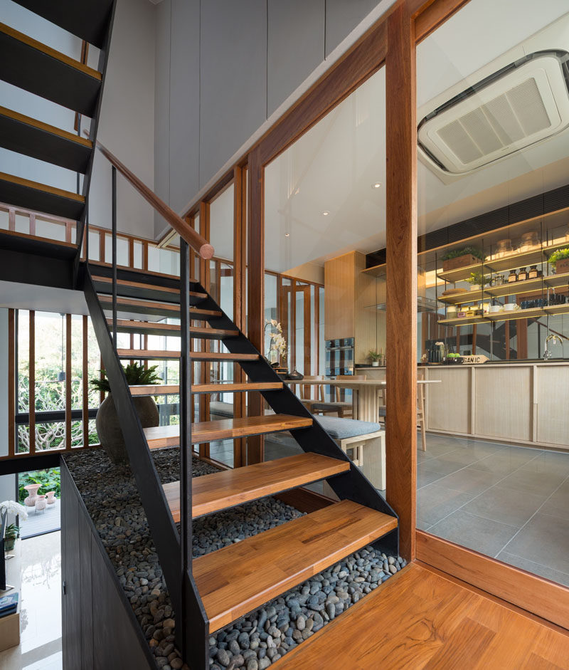 These wood and steel stairs lead to the upper floors of this modern home.
