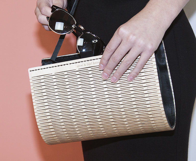 This fashionable women's clutch named PLAAT, has an exterior made from wood that's been laser cut, while the interior is made from a black leather. The clutch is also designed so that it can become a handbag or a shoulder bag too.