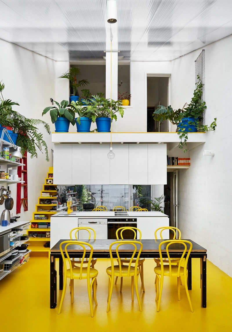 These bright yellow stairs with storage have been designed with open fronts instead of drawers, so you can easily see what is being stored.