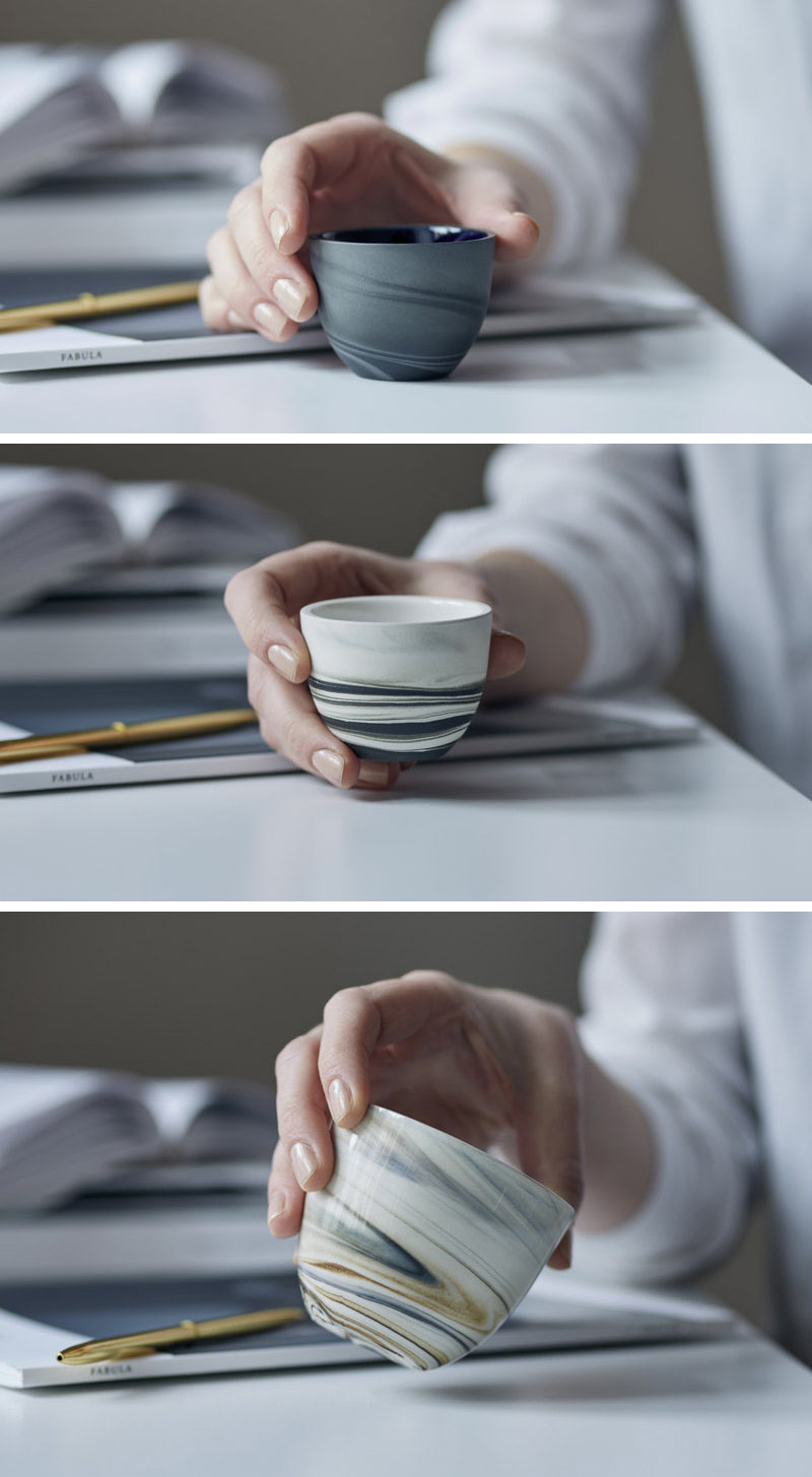 These modern glossy espresso cups are white grey black and cream colored. 