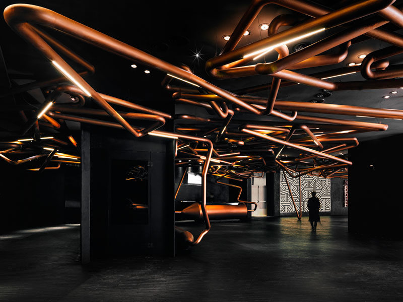 ONE PLUS Partnership designed this cinema to pay homage to the movie industry, by creating a copper track, similar to those used when filming a tracking shot, that runs throughout the lobby and even in some of the theaters.