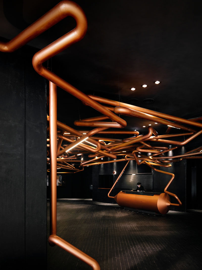 ONE PLUS Partnership designed this cinema to pay homage to the movie industry, by creating a copper track, similar to those used when filming a tracking shot, that runs throughout the lobby and even in some of the theaters.