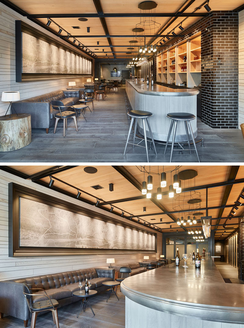 Entering the tasting room, a forty foot custom made art piece hangs above the seating, opposite of the bar. The casual seating and the neutral tones of the ceiling, walls, and flooring contrast with the dark furniture and light fixtures to create a contemporary look.