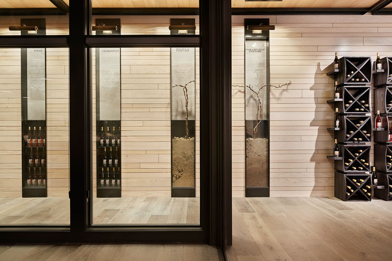 A set of inset glass vitrines have been added to showcase earth and vines taken from a vineyard, allowing the winery to highlight the natural process of transforming grapes into wine.