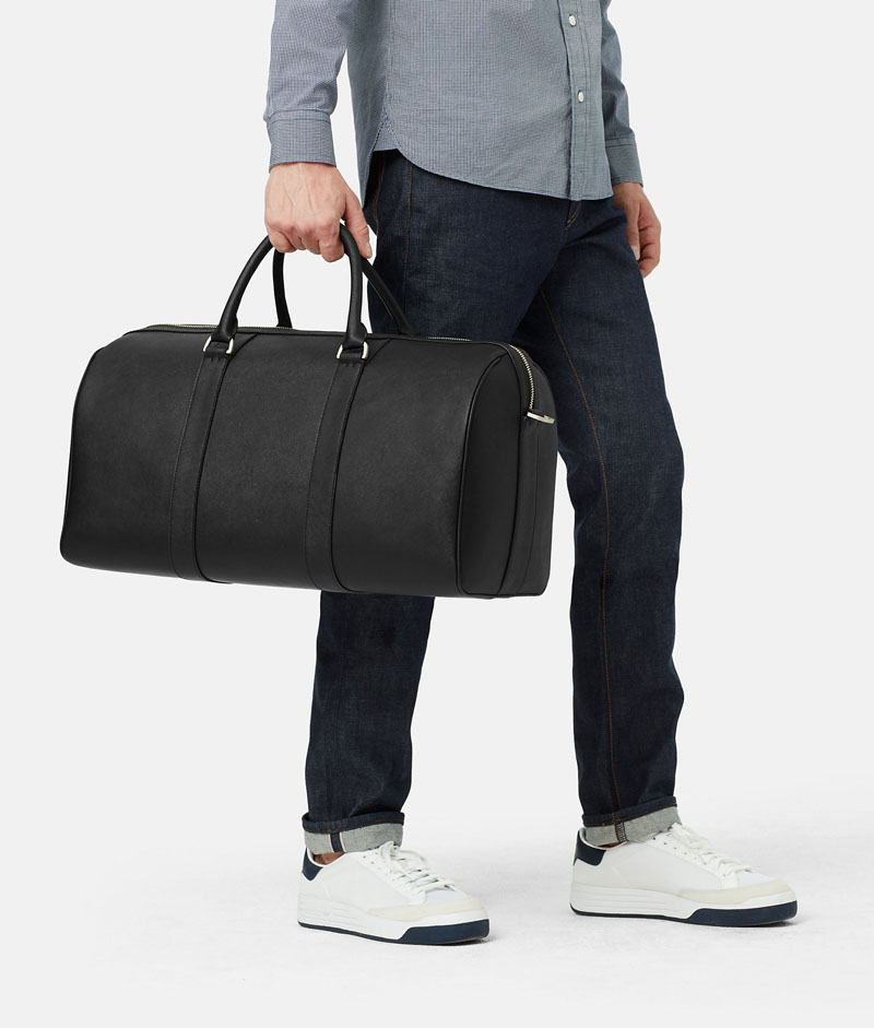 This clean, modern, black leather duffel bag adds sophistication and class to all who carry it.