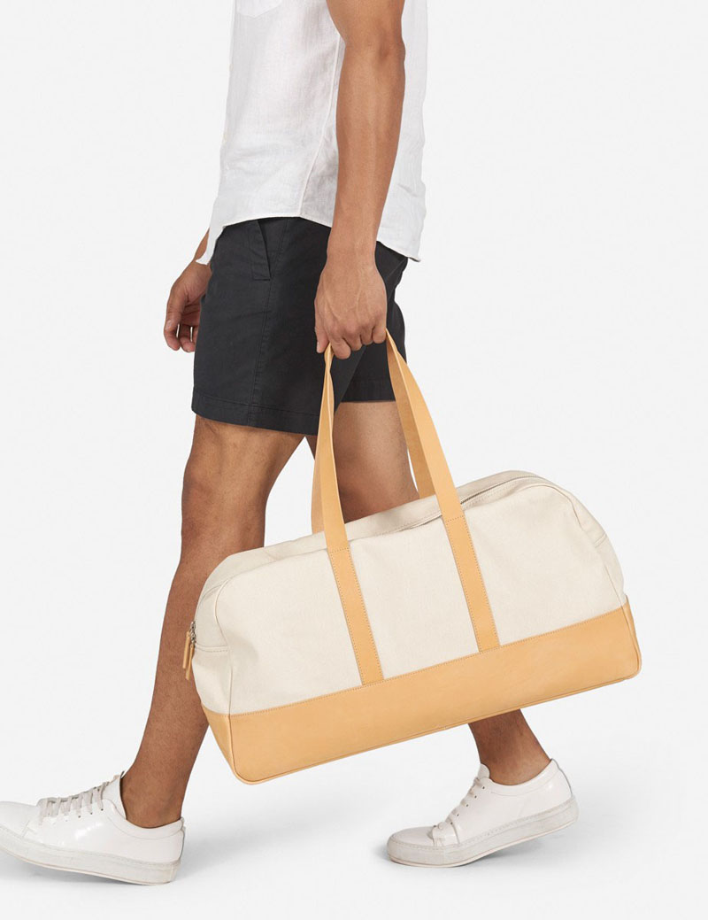 This modern leather duffel bag is light in color and perfect for the spring and summer seasons