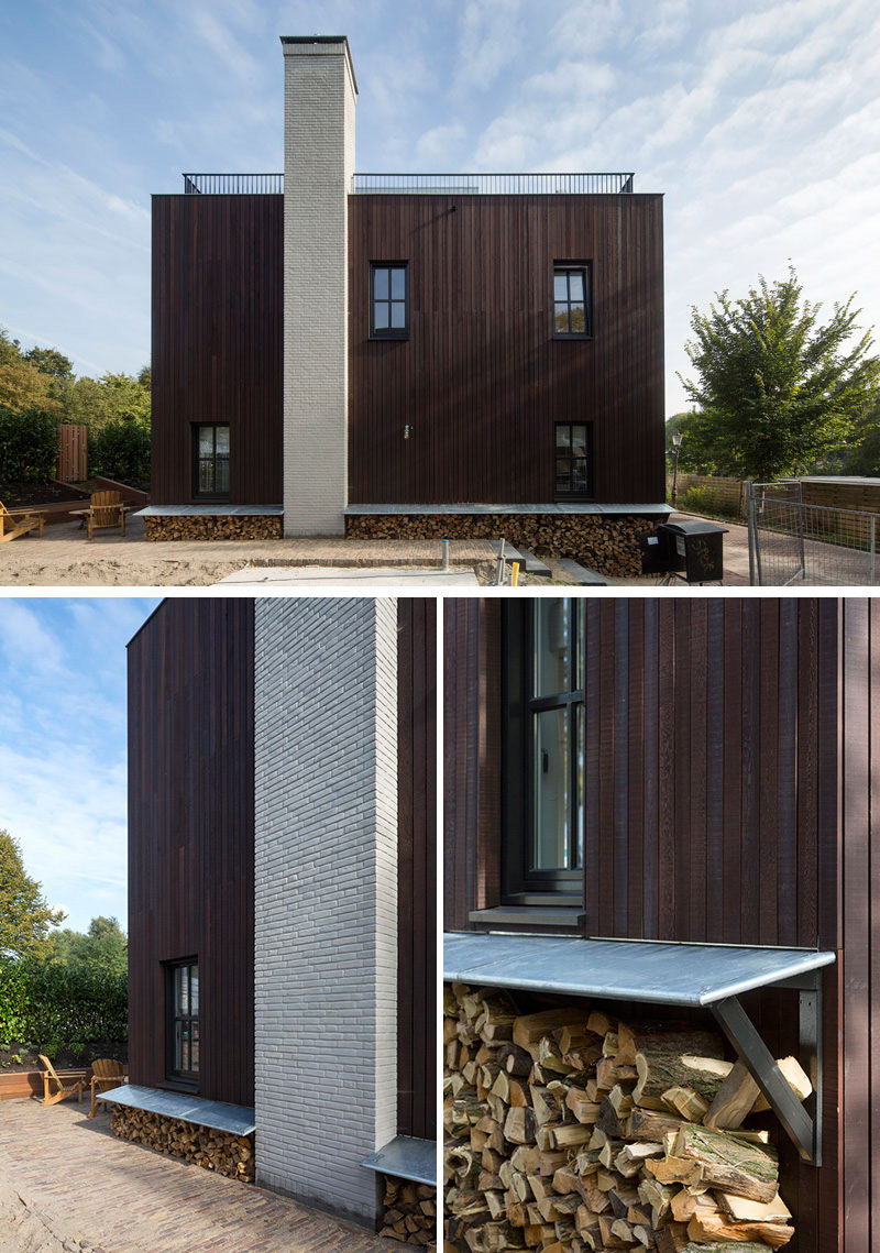 Cut-up firewood is cleverly stored along the left side of this modern home. White brick is used to make the chimney stand out against the wood siding.