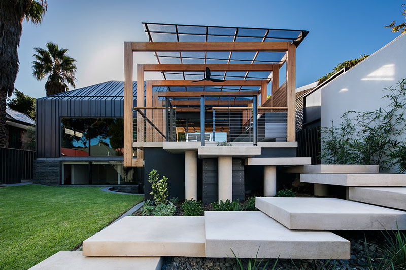 Architecture firm Glasshouse designed a family friendly backyard space with a number of design details like a modern pergola and entertaining deck, and a swimming pool.