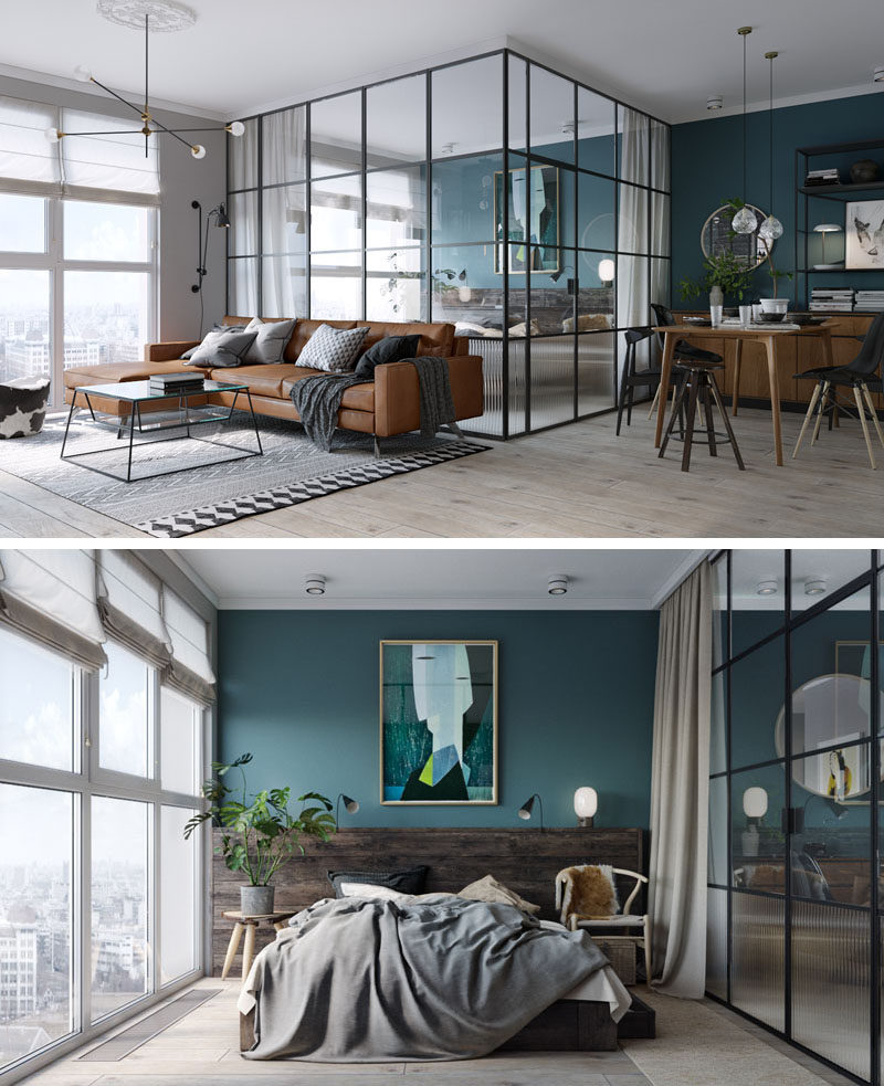 In this small and modern apartment, the bedroom has a deep teal and wood accent wall providing the perfect backdrop for the artwork and bed, while black framed glass walls separate the bedroom from the living and dining area and allow the light from the windows to travel throughout the small apartment. At night, blinds and curtains can be drawn to provide privacy.