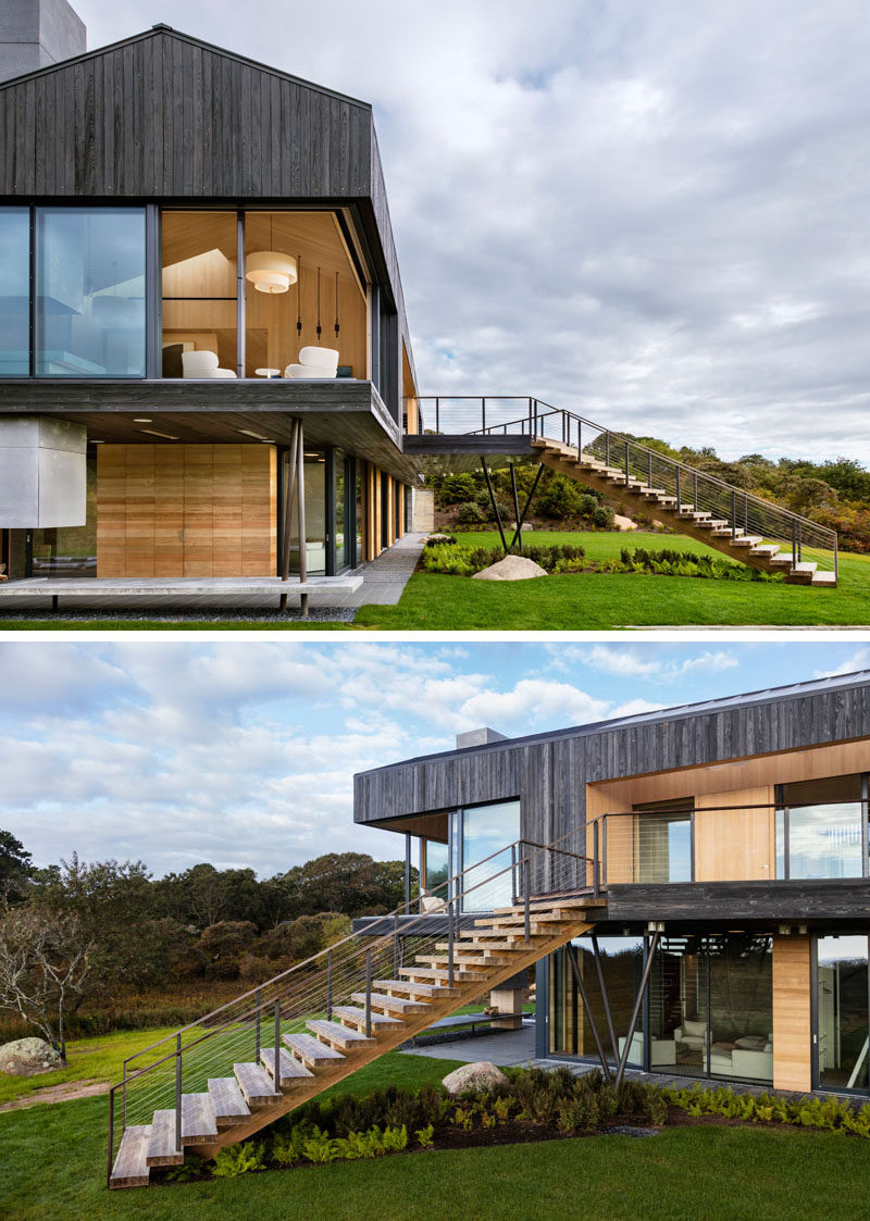 This modern house, which sits on 4.25 acres, overlooks the sea and is surrounded by farmland. The upper floor of the home has direct access to the landscaped yard via angled stairs.