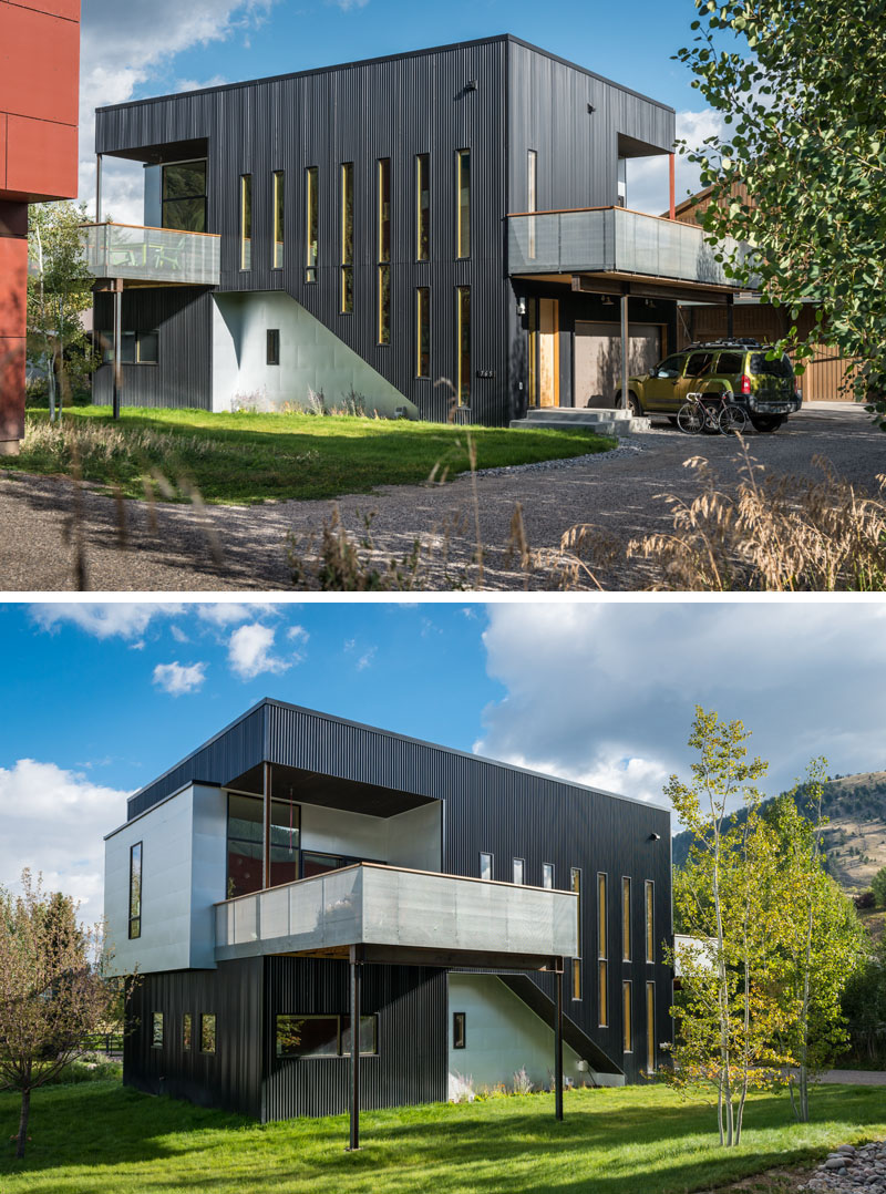 The black exterior siding of this modern home suits it's industrious style. #ModernBlackHouse #BlackHouse #BlackExterior #BlackArchitecture