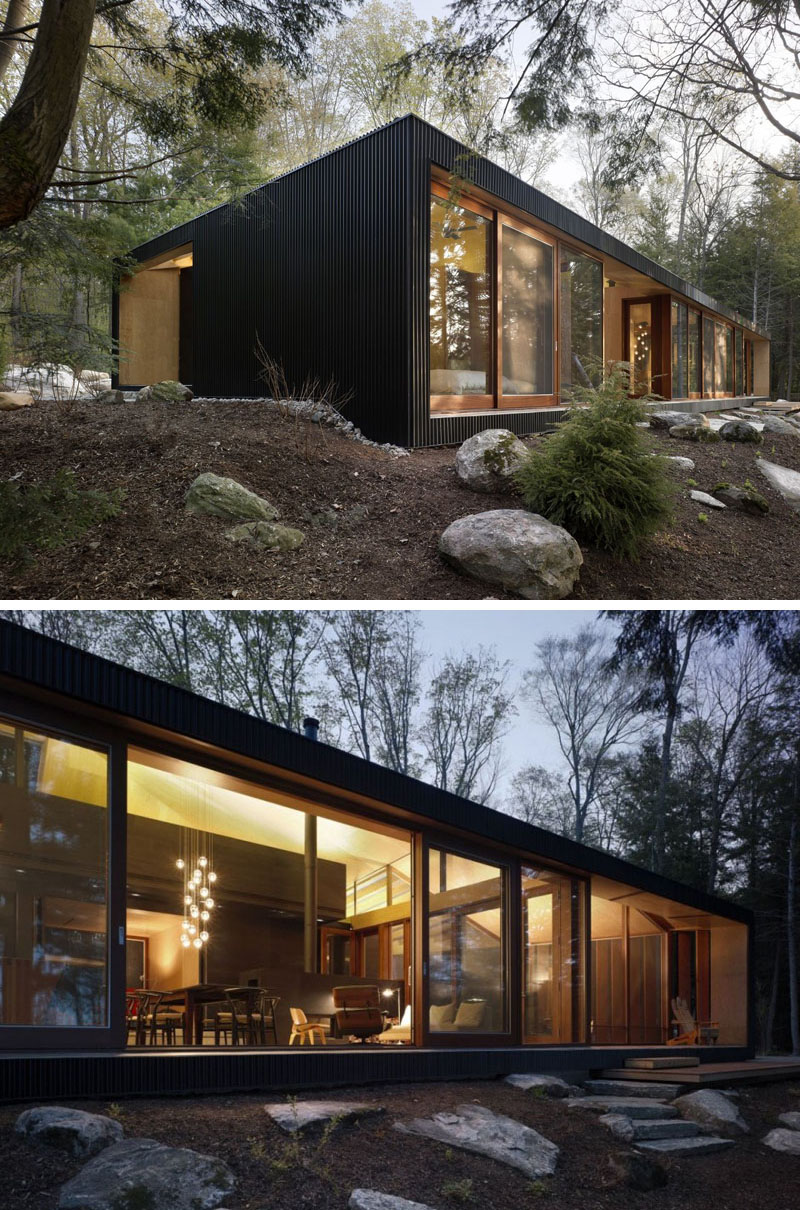 The only parts of this modern home not covered in black siding are the floor to ceiling windows and doorways. #ModernBlackHouse #BlackHouse #BlackExterior #BlackArchitecture