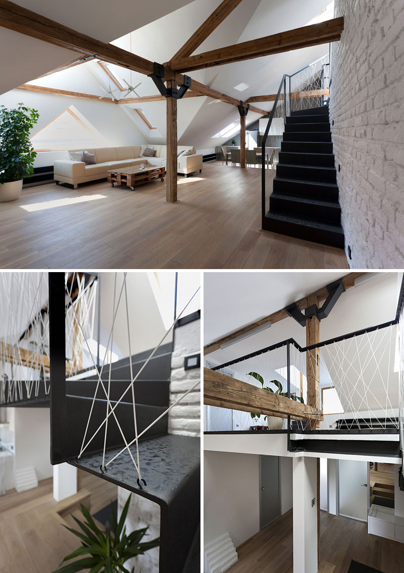 The white rope zig-zagging up the banister of these modern black steel stairs creates an industrial look consistent with the other industrial elements in the loft.