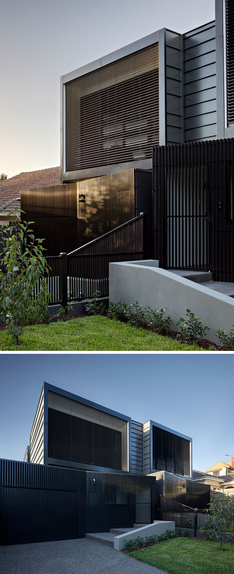 The exterior of the black modern townhouses have lightweight aluminium batten screening, and metal cladding. 