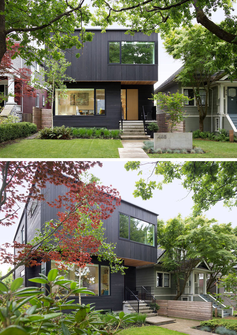 Black wood siding covers the exterior of this suburban modern family home. #ModernBlackHouse #BlackHouse #BlackExterior #BlackArchitecture