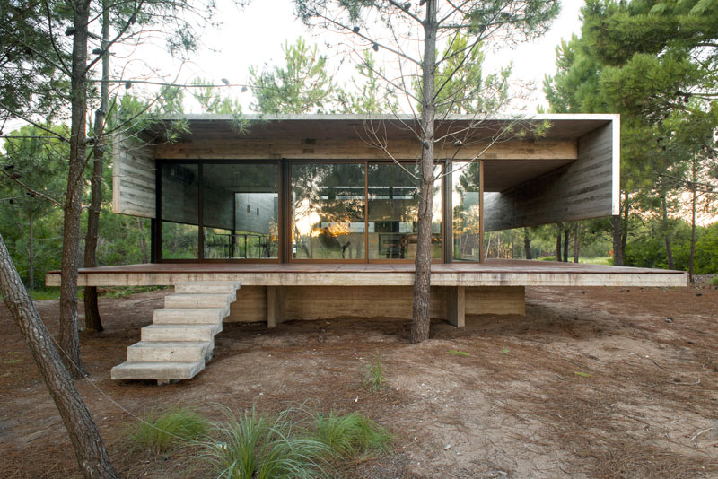 This modern concrete home has two levels separating the social areas from the sleeping areas.