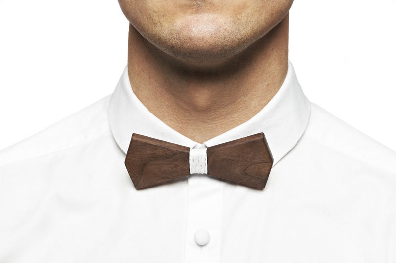 The contrast between the dark wood and the white string wrapped around the center gives this modern wood bow tie a contemporary look that's neutral enough to be worn with any men's outfit