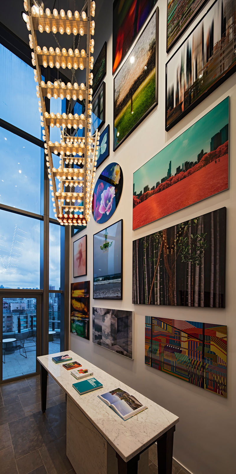 This modern clubhouse has a large wall gallery full of art.