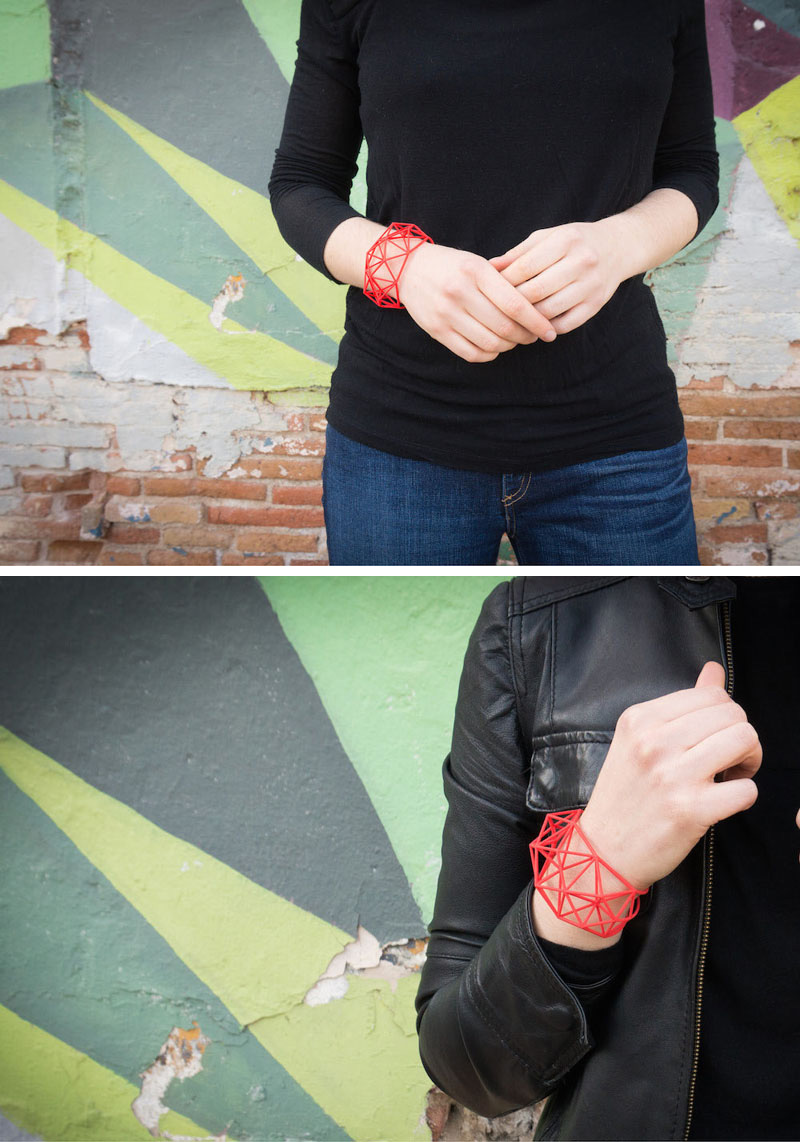 These modern red geometric bracelets are 3D printed using nylon and plastic as the main materials. 