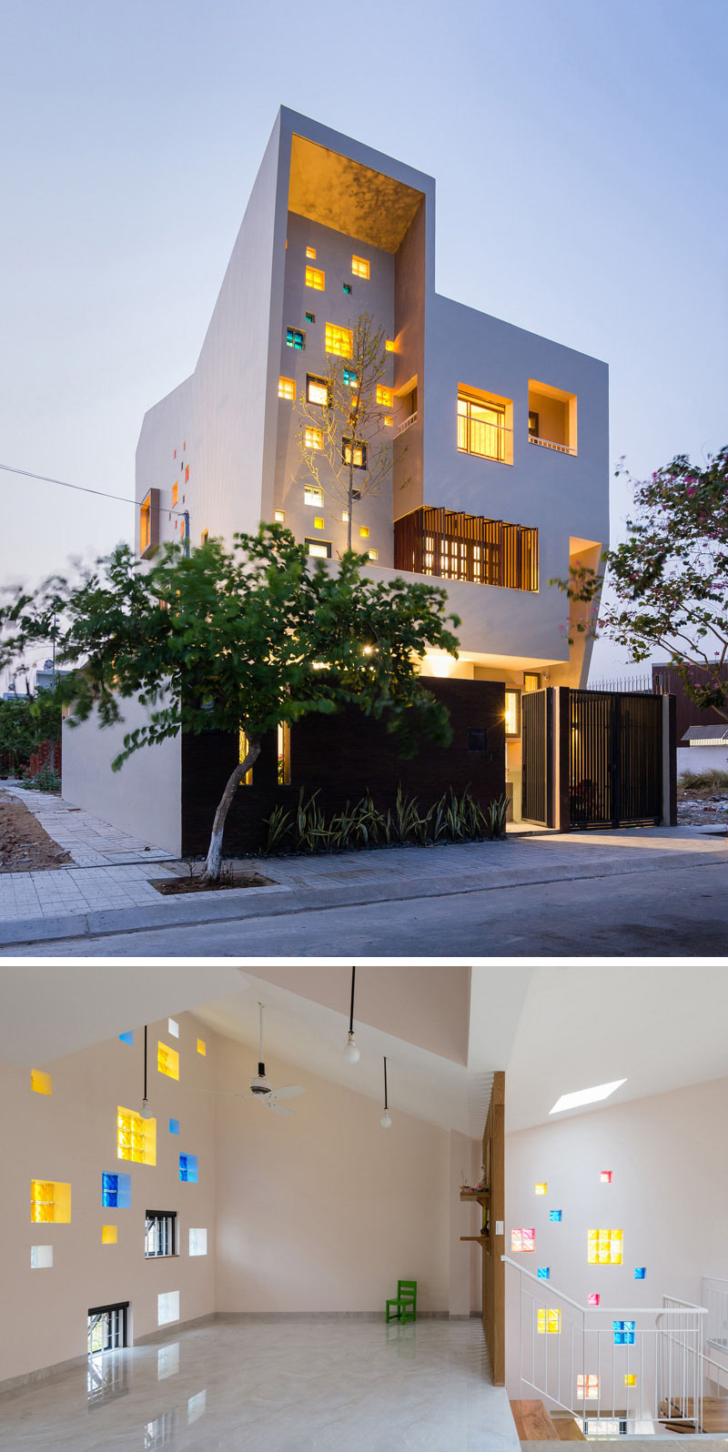 The yellow, blue, and pink glass windows throughout this modern house make it glow from the outside, and break up the white space on the inside.