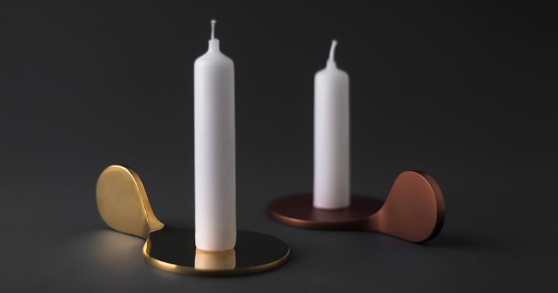 These modern gold and bronze metal candle holders are minimalist in their design and easy to use.
