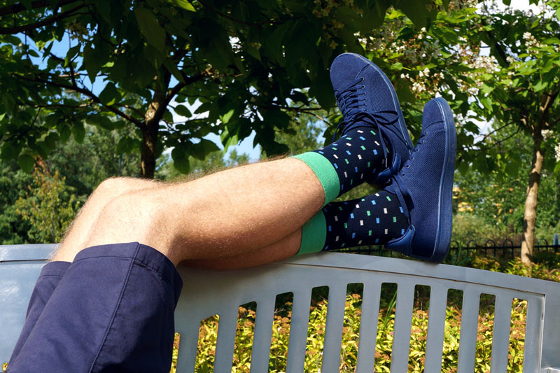  These multi-colored patterned socks have a bold green band making them modern and standout.