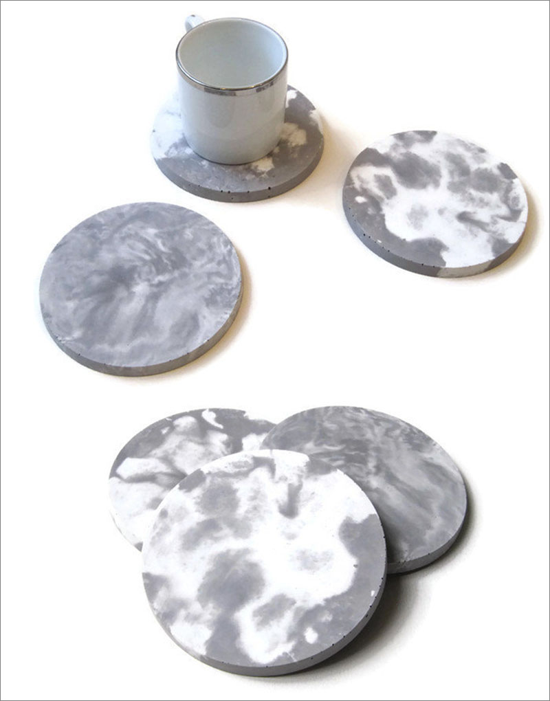 Simple grey and white, circular marble concrete coasters add style and sophistication to your modern home decor