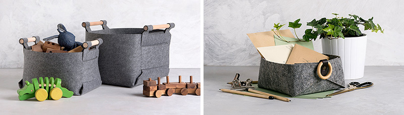 These modern grey storage baskets are made from industrial grade felt, brass snaps, and wood handles.