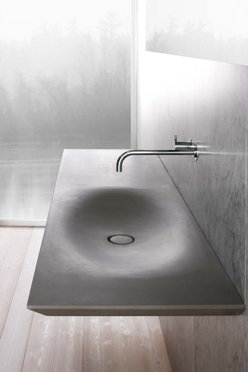 This modern sink has all of the benefits of an integrated sink as well as the benefits of having grey stone countertops, including durability.