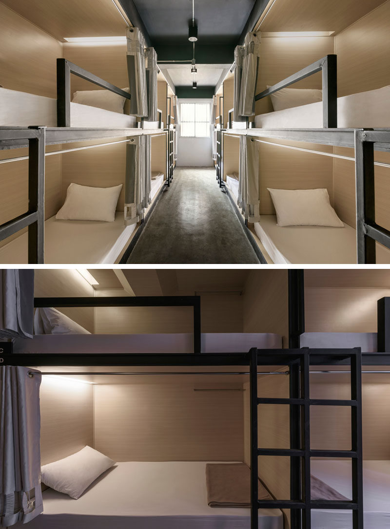 This modern hostel in Bangkok has rooms that are set up in a bunk bed arrangement, with each bunk having their own curtain and reading lamp.