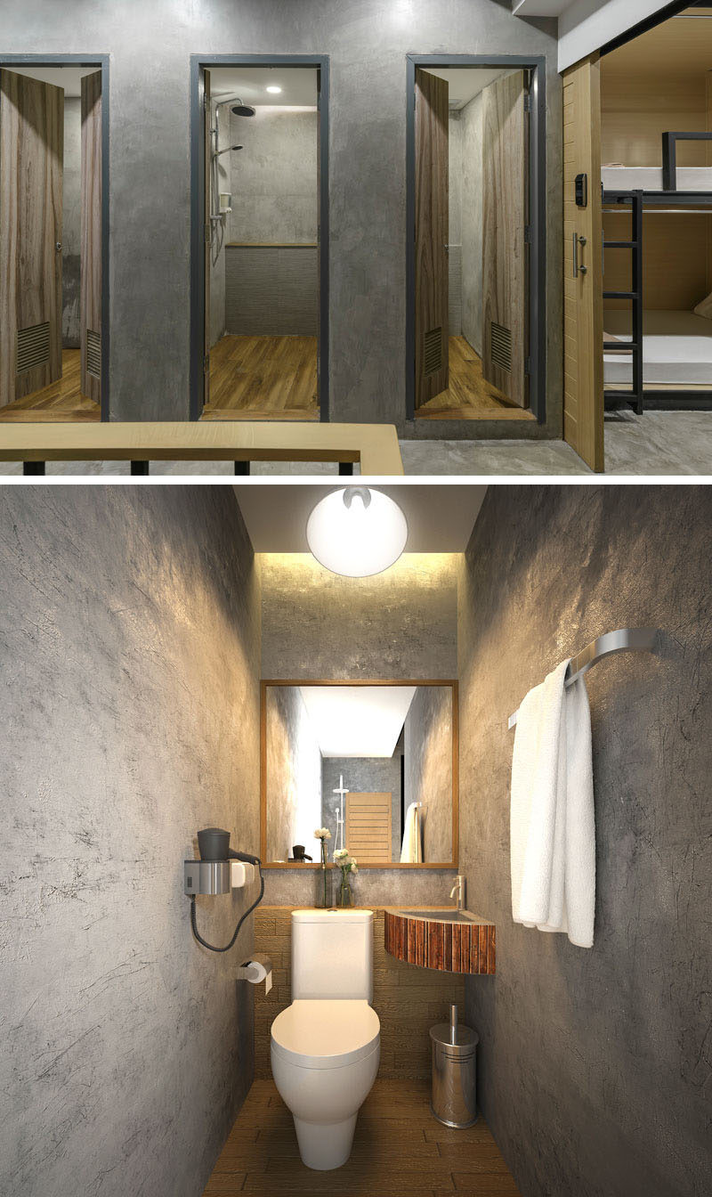 The bathrooms in this modern hostel, can be found on each floor and they are minimal in their design, with wood doors and concrete walls.