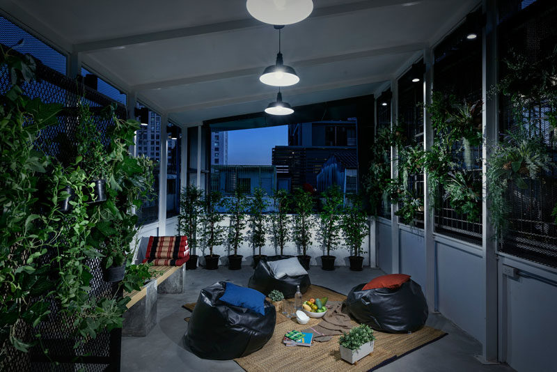 This modern hostel in Bangkok has a communal outdoor space for relaxing and enjoying the city views.