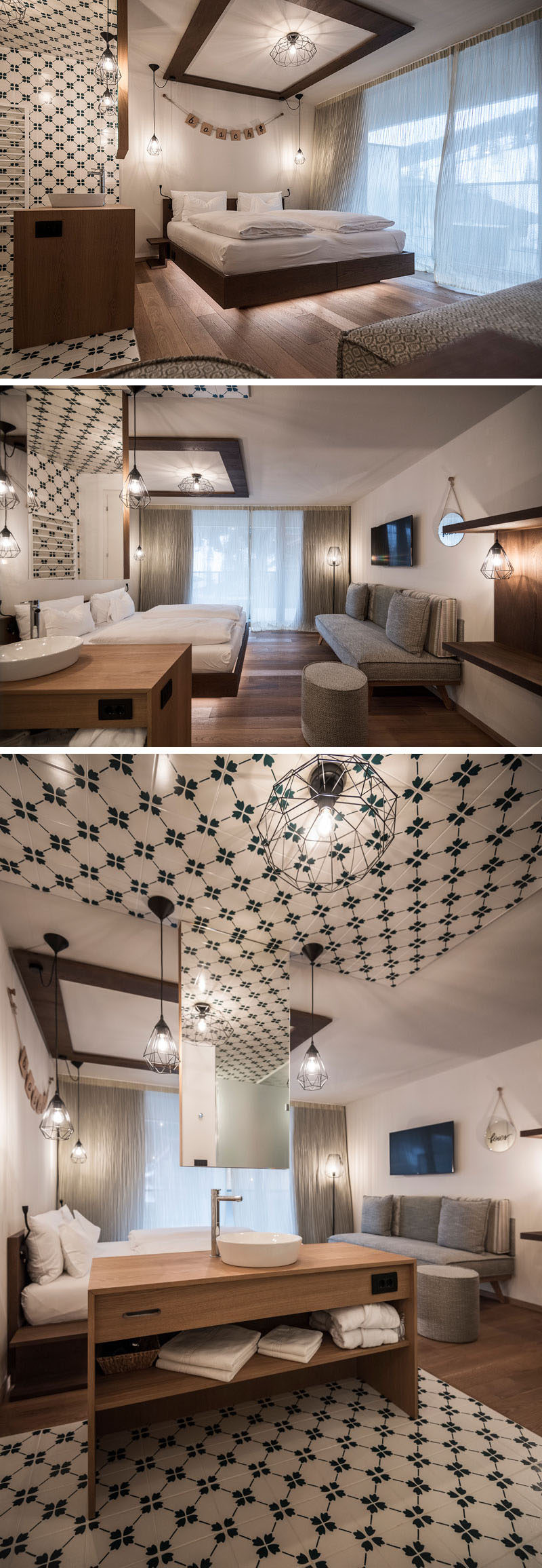 Green and white tiles designate the washroom in this modern hotel room, that has a mirror hanging from the ceiling and a wood vanity. The bed sits opposite the gray sofa, and appears to be floating because of the LED lights hidden underneath.