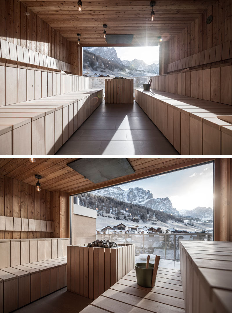 This modern hotel has a spacious sauna that's paneled in light wood, and has a floor to ceiling window at the end of the room that allows for views of the mountains. 