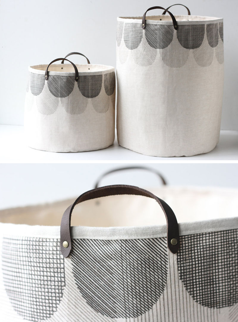 Light in color with dark screen printed scallops, these modern laundry hampers are made from 100% linen and have handles made from dark brown leather. A heavy canvas lining helps keep these hampers sturdy and durable.