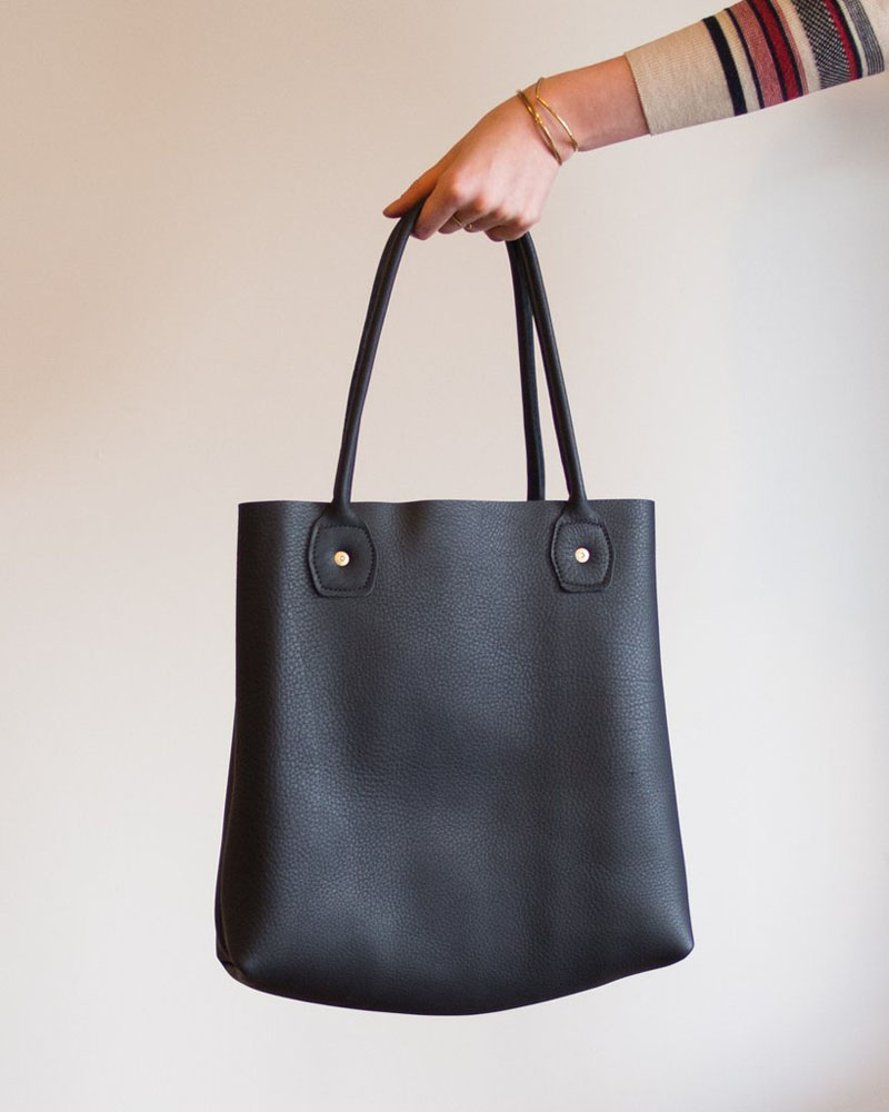 This modern black leather tote slouches perfectly and is very sturdy. 