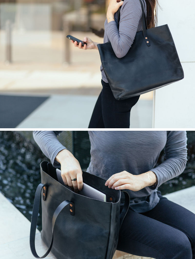 This modern black leather bag features an interior pocket, copper rivets, and a solid bottom to make it the perfect everyday tote.